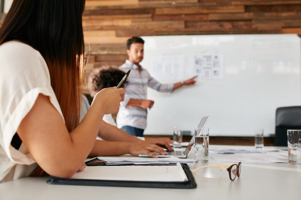 Young woman at presentation in boardroom